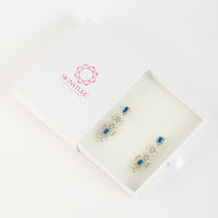 Sparkling Brass & Zircon Drop Earrings with Blue Accents